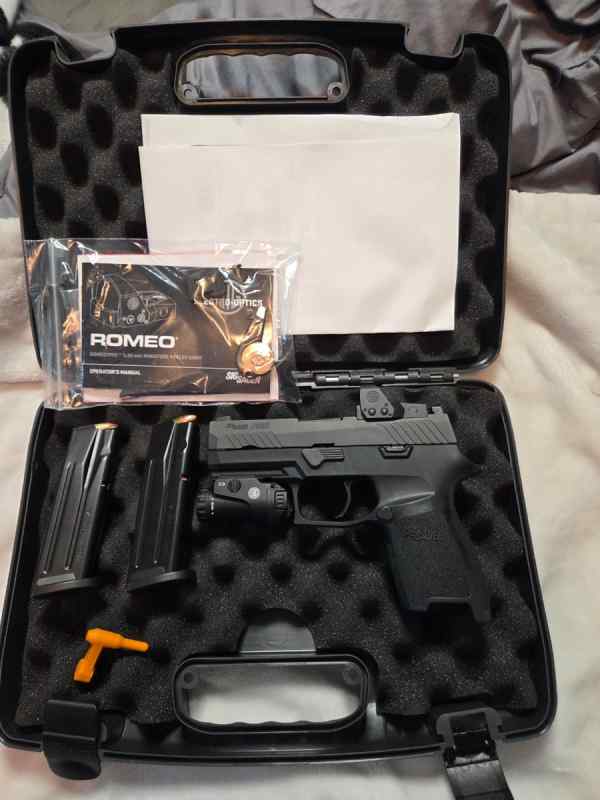 Sig p320c nitron W/Extras.   Located in Ocala 